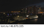 Singapore - 25 September 2018: Singapore skyscraper building at Marina Bay Sands at night with beautiful lights of big night city. Редакционное фото, фотограф David Kashakhi / Фотобанк Лори