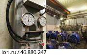 Large industrial boiler room, pipes of central heating system and water pipes with thermal insulation. Стоковое фото, фотограф David Kashakhi / Фотобанк Лори