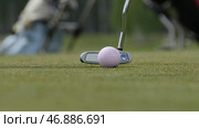 Golfer Hitting Golf Shot with Club on the Course. Стоковое фото, фотограф David Kashakhi / Фотобанк Лори