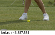 Golfer Hitting Golf Shot with Club on the Course. Стоковое фото, фотограф David Kashakhi / Фотобанк Лори