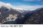 Panoramic view of beautiful white winter wonderland scenery with snowy mountain summits. Стоковое фото, фотограф David Kashakhi / Фотобанк Лори