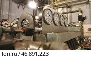 Close up of manometers, pipes and faucet valves of heating system in a boiler room. Стоковое фото, фотограф David Kashakhi / Фотобанк Лори