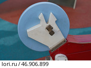 Москва, Россия - 2 июля 2019: Качалка на пружинке в форме собаки в скафандре на детской площадке Космос на ВДНХ. Редакционное фото, фотограф YuryKara / Фотобанк Лори