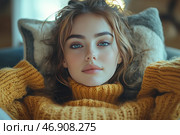 A young girl with expressive blue eyes and natural facial features. She lies comfortably nestled on pillows and wears a warm knitted sweater of mustard color. Her hair is slightly disheveled, and her gaze is soft and relaxed. The atmosphere of the image conveys warmth, comfort and calm. The light is soft and natural, creating a feeling of comfort and coziness. Стоковое AI-изображение, AI-художник Анна Кривицкая / Фотобанк Лори