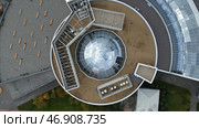 Concept of architecture, round shaped beautiful building and green lawn. Стоковое фото, фотограф David Kashakhi / Фотобанк Лори