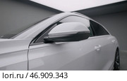 Modern car, view of car exterior, side doors and mirror, smooth camera movement. Стоковое фото, фотограф David Kashakhi / Фотобанк Лори