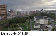The view from the drone.Beautiful Yekaterinburg.Stock footage.Gray City, the largest of the Urals, filmed in the center of the city with all the high-rises and the long Iset River is visible. Стоковое фото, фотограф David Kashakhi / Фотобанк Лори