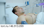 Man in hospital bed after serious operation. Стоковая иллюстрация, иллюстратор David Kashakhi / Фотобанк Лори