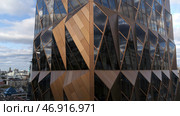 Stock footage.A huge newest office located in the city center next to other simpler buildings. Стоковое фото, фотограф David Kashakhi / Фотобанк Лори