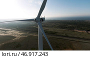 Beautiful windmills, blue cloudy sky and farm fields. Стоковое фото, фотограф David Kashakhi / Фотобанк Лори