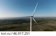 Beautiful windmills, blue cloudy sky and farm fields. Стоковое фото, фотограф David Kashakhi / Фотобанк Лори