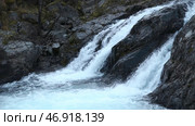 Beautiful bubbling waterfall water in stream on rocky terrain. Стоковое фото, фотограф David Kashakhi / Фотобанк Лори