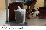 Trash bin - basket full of wastepaper in office. Стоковое фото, фотограф David Kashakhi / Фотобанк Лори