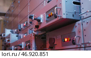Many buttons light up on control panels in electrical industry. Стоковое фото, фотограф David Kashakhi / Фотобанк Лори