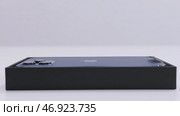 Warsaw, Poland - 11.20.2020: Close up of a new Apple Iphone 12 pro max in a box. Редакционное фото, фотограф David Kashakhi / Фотобанк Лори
