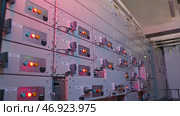 Many buttons light up on control panels in electrical industry. Стоковое фото, фотограф David Kashakhi / Фотобанк Лори