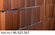 Close-up of background of red brick wall made of blocks. Стоковое фото, фотограф David Kashakhi / Фотобанк Лори