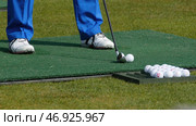 Golfer Hitting Golf Shot with Club on the Course. Стоковое фото, фотограф David Kashakhi / Фотобанк Лори