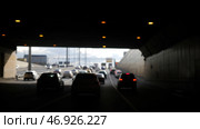 Asphalt road under the steel construction of a bridge in the city. Стоковое фото, фотограф David Kashakhi / Фотобанк Лори