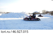 Kart racing on the frozen lake. Стоковое фото, фотограф David Kashakhi / Фотобанк Лори