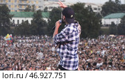 Russia - Moscow, 10.02.2019: russian hip hop and rap live music concert with a frontman and cheering fans. Редакционное фото, фотограф David Kashakhi / Фотобанк Лори