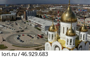 Aerial view of the city square and a church with golden domes. Стоковое фото, фотограф David Kashakhi / Фотобанк Лори