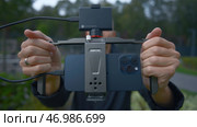 China, Beijing - September 15, 2023: iPhone 15 pro with stabilizer. Редакционное фото, фотограф David Kashakhi / Фотобанк Лори