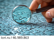 Close-up showing the process of examining a completed puzzle with a magnifying glass. A human hand holds a magnifying glass over puzzle pieces that have a bluish tint. Through the glass, you can see an enlarged portion of the image, emphasizing the details of the lines and joints of the puzzle pieces. The focus is on finding the perfect match of the pieces. The image symbolizes attention to detail, the process of analyzing and finding solutions. Стоковое AI-изображение, AI-художник Анна Кривицкая / Фотобанк Лори