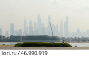 View from the embankment on the city sky scrapers in fog. Стоковое фото, фотограф David Kashakhi / Фотобанк Лори