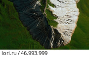 Frozen stone formations and green grass. Стоковое фото, фотограф David Kashakhi / Фотобанк Лори