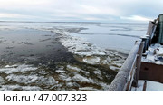Aerial view of a barge on a winter river with ice. Стоковое фото, фотограф David Kashakhi / Фотобанк Лори