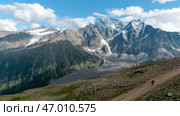 View from the hill top of endless snow capped mountain range. Стоковое фото, фотограф David Kashakhi / Фотобанк Лори
