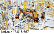 Fast-working robots that work in production. Редакционное фото, фотограф David Kashakhi / Фотобанк Лори