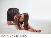 Expressive Dance in a Minimalist Indoor Setting Showcasing Graceful Movement and Elegance. Стоковое фото, фотограф Aleksandr Golubev / Фотобанк Лори