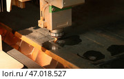 The process of cutting parts from a sheet of metal using a CNC machine. Стоковое фото, фотограф David Kashakhi / Фотобанк Лори