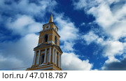 Time lapse accelerated movement of clouds in the blue sky over the Christian Church. Стоковое фото, фотограф David Kashakhi / Фотобанк Лори