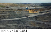 An Aerial View of an Extensive OpenPit Mining Operation and its Surrounding Areas. Стоковое фото, фотограф David Kashakhi / Фотобанк Лори