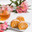 Pumpkin and carrot roll with cream filling on a white background as a sweet for a tea party with copy space. Стоковое фото, фотограф Неведицына Елена / Фотобанк Лори