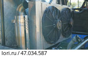 Close-up of the robust cooling system with two large fans next to the exhaust. An off-roader for heavy off-roading. Стоковое фото, фотограф Воловодов Владимир / Фотобанк Лори
