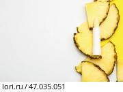 Натуральный бальзам для губ с ананасом на белом фоне. Стоковое фото, фотограф Pixel_shot / Фотобанк Лори