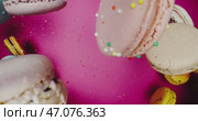 A Vibrant and Colorful Collection of Macarons Beautifully Displayed on a Pink Background. Стоковое видео, видеограф Владимир Ковальчук / Фотобанк Лори