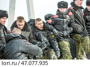 Праздник Масленица, взятие снежного городка. Территория Кафедрального собора в честь Преображения Господня. Город Бердск, Новосибирская область, Западная Сибирь, Россия. Редакционное фото, фотограф Евгений Мухортов / Фотобанк Лори