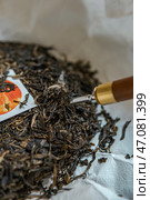 Indulge in our exquisite HighQuality Loose Leaf Tea that boasts a Premium Label of distinction. Стоковое фото, фотограф David Kashakhi / Фотобанк Лори