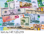 Money background from banknotes of various currencies. Стоковое фото, фотограф FotograFF / Фотобанк Лори