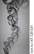 Abstract Black Smoke on Gray Background, wispy and swirling pattern. with copy space. Стоковое AI-видео, аниматор KATERINA AI / Фотобанк Лори