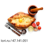 Вкусные хачапури по-аджарски со специями на белом фоне. Стоковое фото, фотограф Pixel_shot / Фотобанк Лори