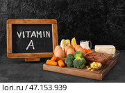 Набор полезных продуктов, богатых витамином А на темном фоне. Стоковое фото, фотограф Pixel_shot / Фотобанк Лори