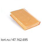 Old book in brown cover isolated on a white background. Стоковое фото, фотограф Елена  Попкова / Фотобанк Лори
