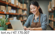 Portrait Asian woman entrepreneur working on laptop computer with SME or startup business at home office. Concept of online business, e commerce, delivery, and dropshipping. Стоковое AI-видео, аниматор Ирина / Фотобанк Лори