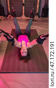 Woman doing inverted fly exercise with suspension trainer. Стоковое фото, фотограф Юрий Поздников / Фотобанк Лори